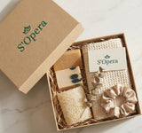 S'Opera gift set with soap, towel, and scrunchie in a box on a marble surface
